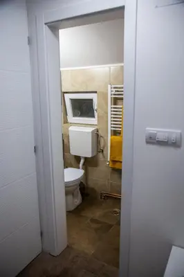 a bathroom with a toilet in a room at Smile in Pirot