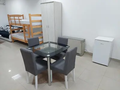 a glass table and chairs in a room at Apartman Aleksić u samom centru grada in Knjazevac.