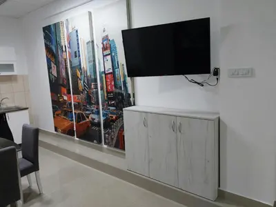 a flat screen tv on a wall in a living room at Apartman Aleksić u samom centru grada in Knjazevac.