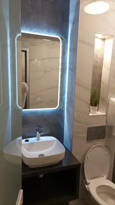 a bathroom with a sink and a toilet at Apartman Nataly in Niš