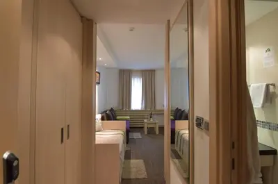 a room with a couch and a living room at Konaci Kopaonik Lux Apartmani in Kopaonik