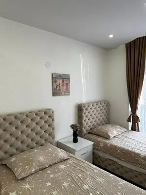 a bedroom with two beds and a window at Hostel Gray in Kruševac