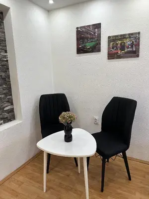 a waiting room with two chairs and a table at Hostel Gray in Kruševac