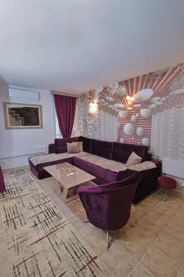 a living room with a couch and a table at GOLD Lux in Vrnjačka Banja