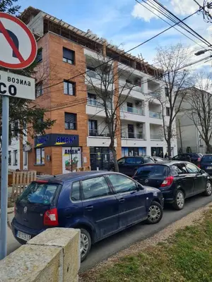 a group of cars parked on the side of a street at Apartman Tina in Vrnjačka Banja