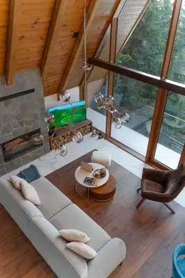 a living room with a couch and a fireplace at Sofia - Mountain Home in Kopaonik