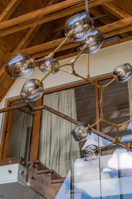 a chandelier hanging from a ceiling in a room at Sofia - Mountain Home in Kopaonik