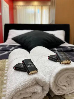 two remote controls sitting on top of a bed at Apartmani Tomašević in Paraćin