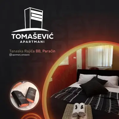 a room with a bed and a sign that reads tunnesciplinary apartment at Apartmani Tomašević in Paraćin