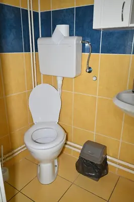 a bathroom with a toilet and a sink at Apartmani Tomašević in Paraćin
