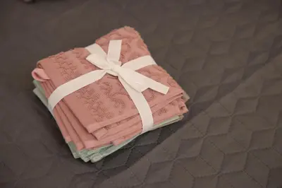a pink cake with a bow on top of it at Soho in Vrnjačka Banja