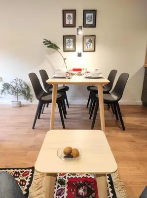 a dining room with a table with a bowl of food on it at Apartman SPEEDY Gondola in Brzeće
