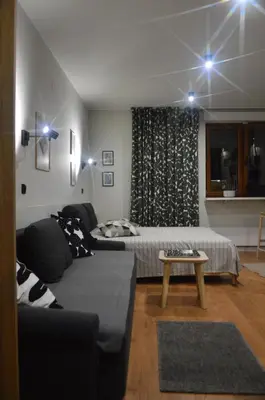 a living room with a couch and a bed at Apartman SPEEDY Gondola in Brzeće