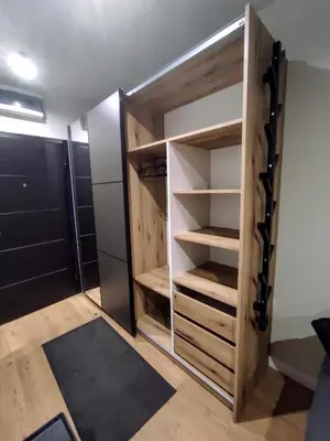 a room with a closet with wooden shelves at Apartman SPEEDY Gondola in Brzeće