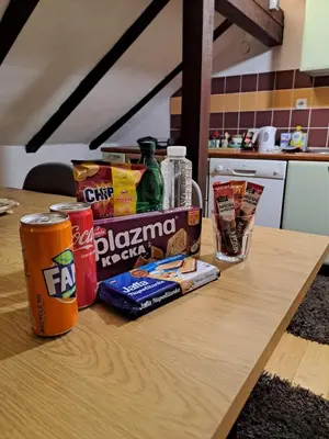 a table with snacks and drinks on top of it at Sofi in Niš