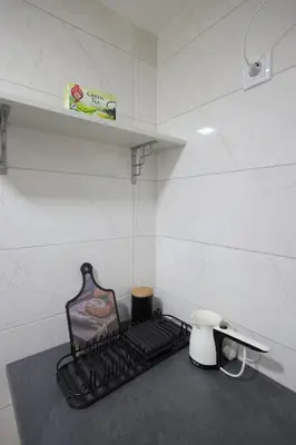 a kitchen counter with a black stove top burner at Soho 1 in Vrnjačka Banja