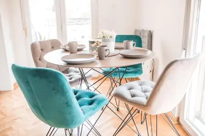 a dining room with a table and chairs at Sunny Paradise in Vrnjačka Banja