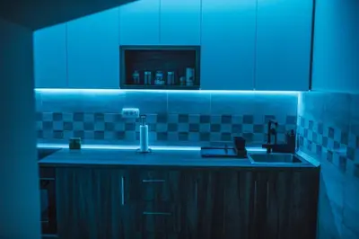 a kitchen with a sink and a blue light at Sunny Paradise in Vrnjačka Banja