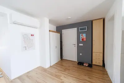 an empty room with a cat laying on the floor at Smestaj Dzentlmen in Soko Banja