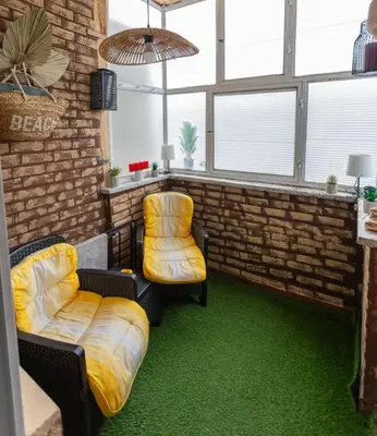 a room with two chairs and green carpet at Fenix1 in Knjazevac.