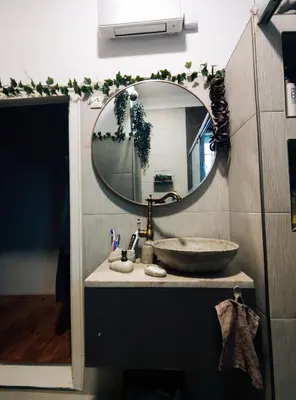 a bathroom with a sink and a mirror at Nirvana apartment in Niš
