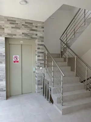 a staircase in a building with a no smoking sign on it at Nikolici - Free Parking in Vranje