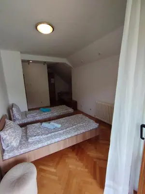 a room with a bed and a mirror at VILA MARKO in Niška Banja