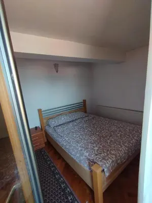 a small bedroom with a bed in a room at VILA MARKO in Niška Banja