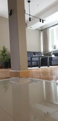 a living room with a couch and a glass table at Dora in Bor