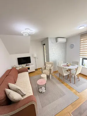 a living room with a couch and a table at Aleksandar apartman Sokobanja in Soko Banja