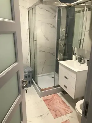 a bathroom with a shower and a sink at Pekakop Treska in Kopaonik