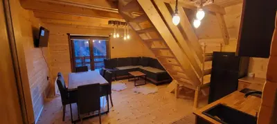 an overhead view of a living room with a table and a couch at Apartmani Prica in Crni Vrh