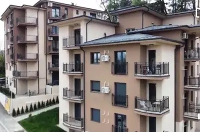an apartment building with balconies on the side of it at Apartman Anastasija Vrnjačka Banja in Vrnjačka Banja