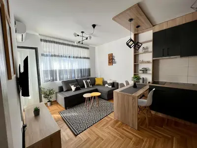 a living room with a couch and a table at Sweet Dreams & Free parking in Vrnjačka Banja