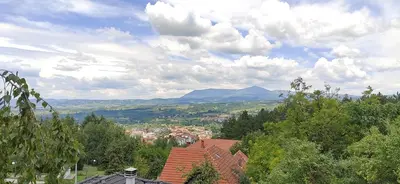 a view of a town with mountains in the distance at Apartman Borići in Soko Banja