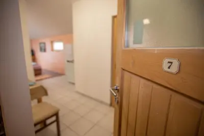 a room with a door with a number seven on it at Apartmani Lazić in Ribarska Banja