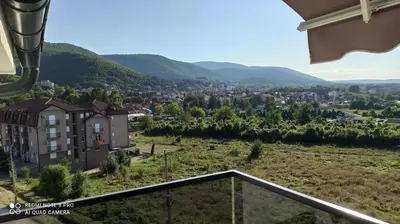 a view of a city from the balcony of a house at Jela Apartman in Soko Banja