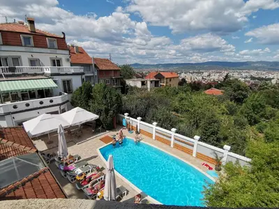 a view of a swimming pool on top of a building at Garni Hotel Panorama Lux in Niš