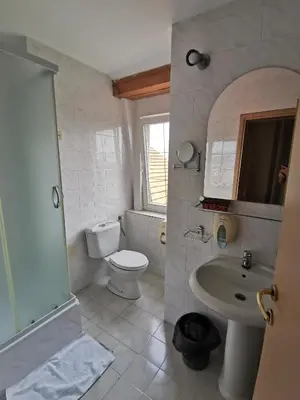 a bathroom with a toilet and a sink at Garni Hotel Panorama Lux in Niš