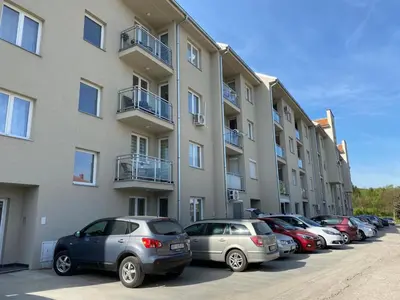 a row of cars parked in front of a building at Apartman Rubi Sokobanja in Soko Banja