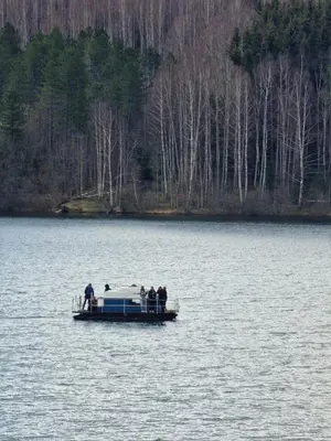 a group of people on a boat on a lake at Vila Vlasina in Vlasina Rid