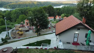 an aerial view of a small house with a driveway at Vila Vlasina in Vlasina Rid