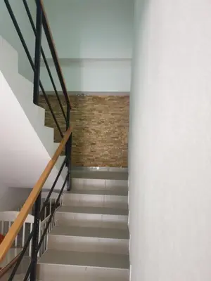 a staircase in a house with a brick wall at Vila Dubrovnik in Vrnjačka Banja