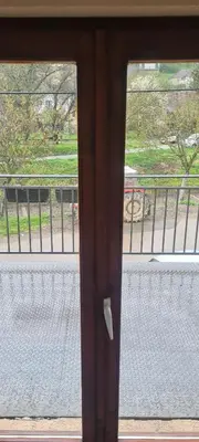 a glass window with a view of a street at Vila Dubrovnik in Vrnjačka Banja