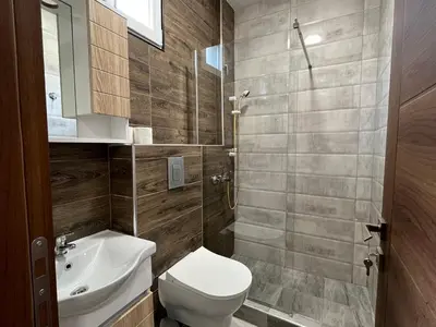 a bathroom with a toilet and a sink at Apartmani Bosfor in Niška Banja