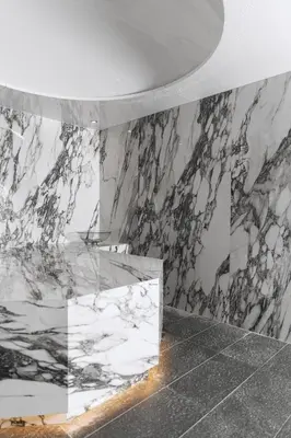 a bathroom with marble walls and a marble counter at Hotel Grand Kopaonik in Kopaonik