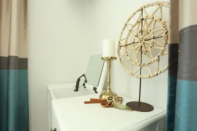 a white shelf with a fan and a lamp on it at Kuća sa bazenom do 10 osoba Freedom Place in Jagodina