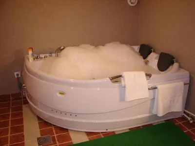 a bath tub covered in snow in a bathroom at HOTEL VILA MITIC LUXX SPA centar in Leskovac