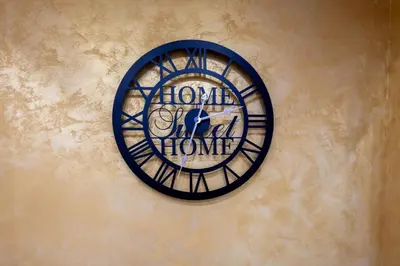 a clock on the side of a building at Andjela Lux in Vrnjačka Banja