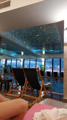 two chairs in a room with a view of the ocean at Milmari Nlux 74 in Kopaonik